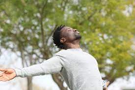 photo of a black man breathing in the open