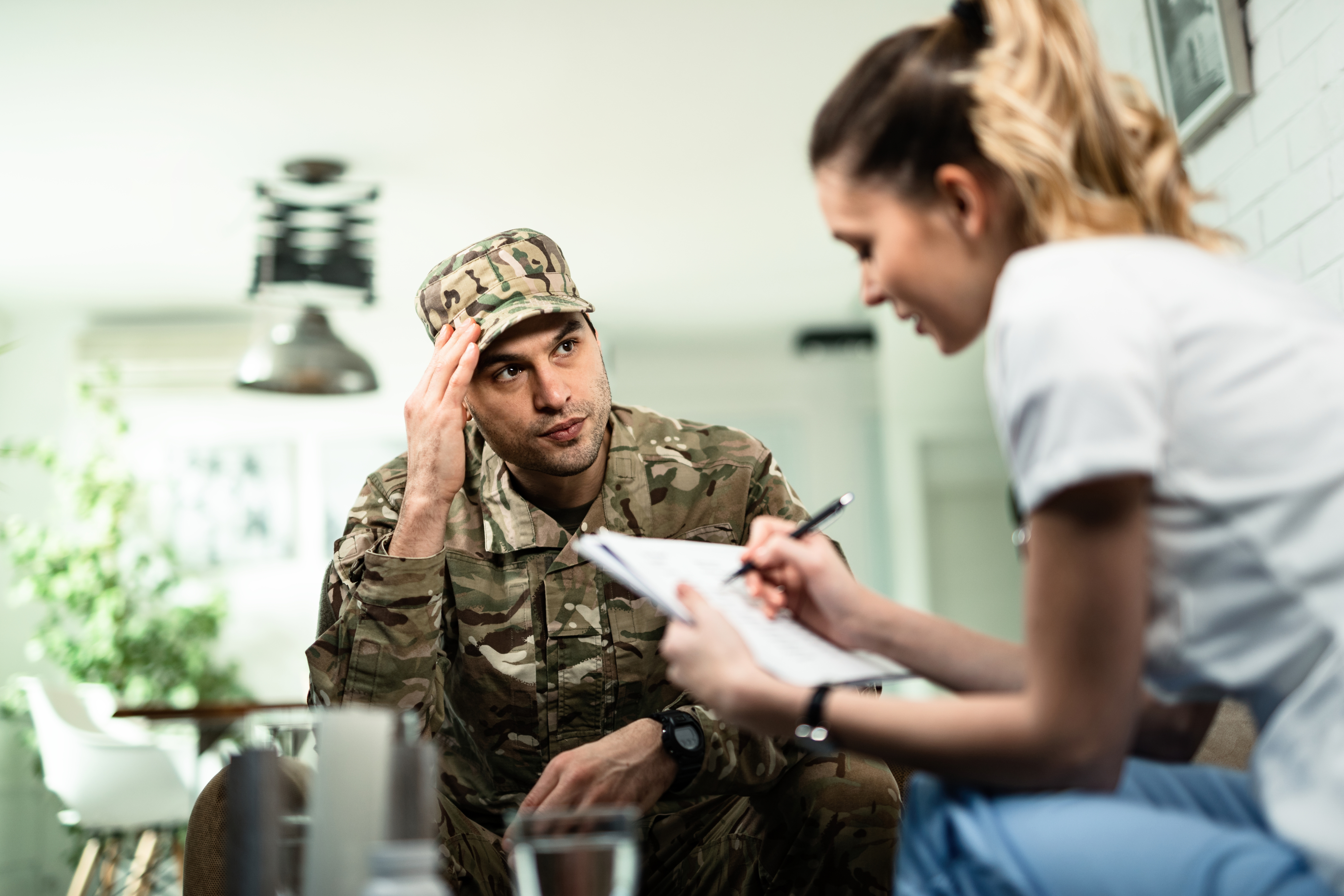 serious military man speaking with doctor